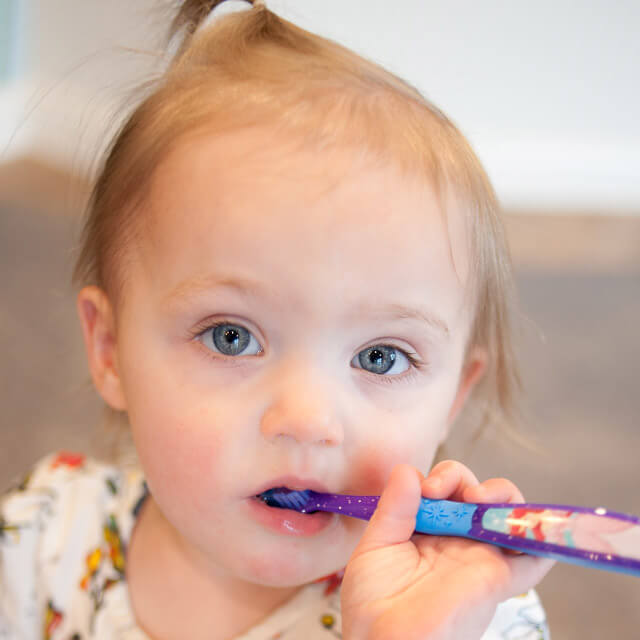 Child brushing teeth